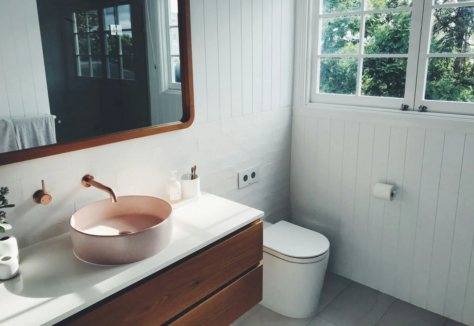 white ceramic sink with stainless steel faucet