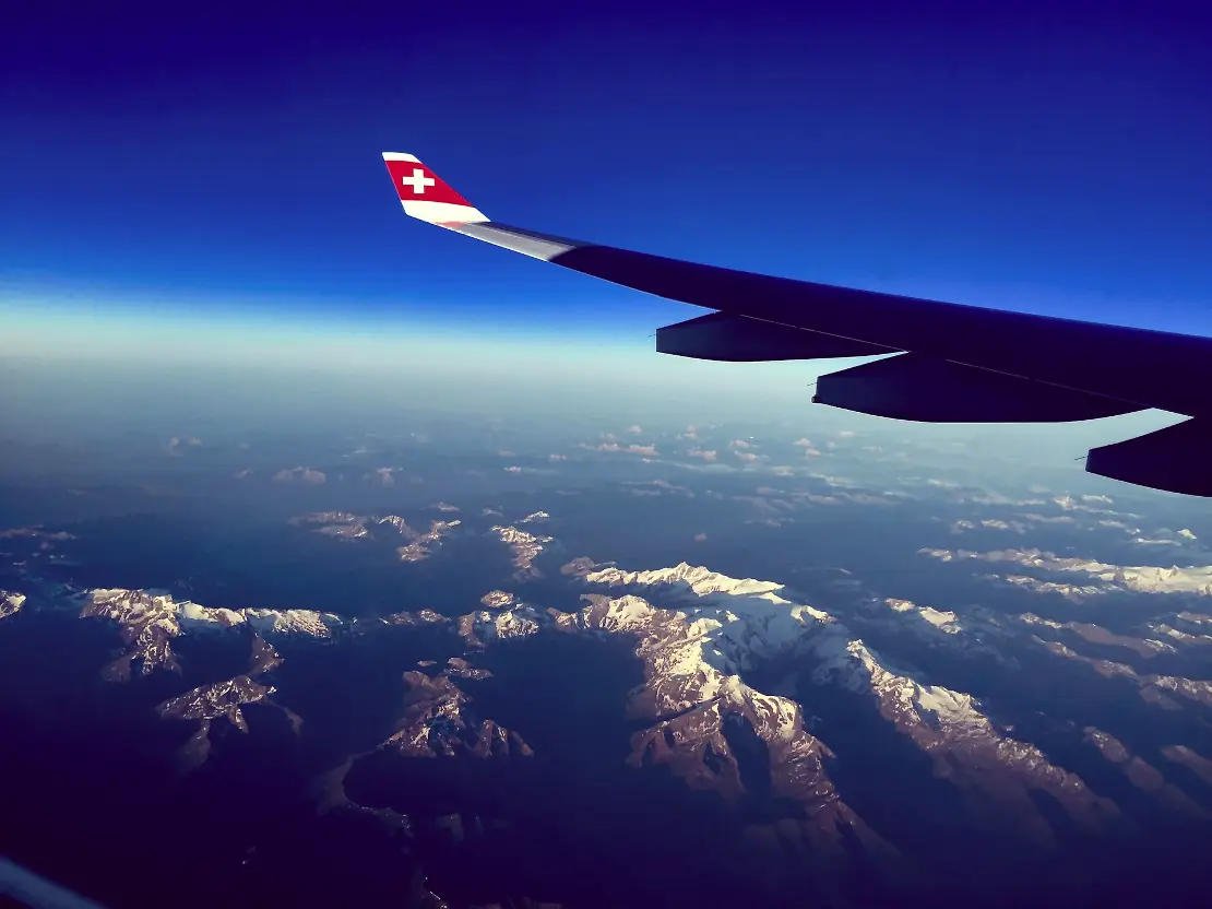 white and blue plane
